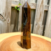 Turn obelisc de cristal Ochiul tigrului natural, VeliumCraft, 7-8 cm, vindecator spiritual, pentru meditatie si echilibru energetic, hexagonal, portocaliu Turn obelisc de cristal Ochiul tigrului natural, VeliumCraft, 7-8 cm, vindecator spiritual, pentru meditatie si echilibru energetic, hexagonal, portocaliu